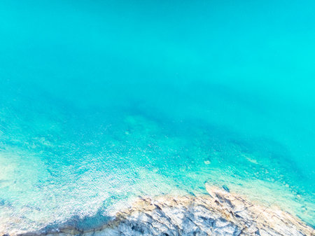 Aerial view of a blue sea surface water texture background,Sun reflections over ocean, Aerial flying drone view Waves water surface texture on sunny tropical ocean in Phuket island Thailandの写真素材