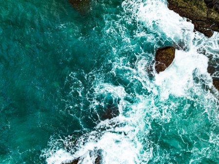 Amazing seascape view seashore and big waves crashing on rocks, Aerial view waves sea surface in Phuket island Thailandの写真素材