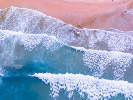 Aerial top view nature background of waves crashing in the ocean sea water, Drone view of sea waves...