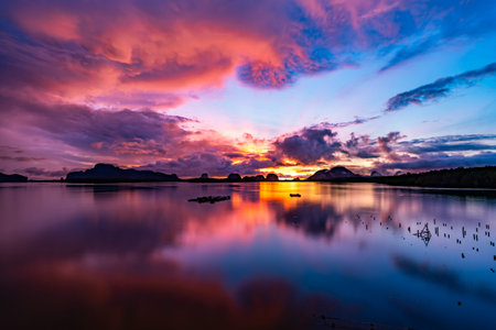 Landscape Long exposure of majestic clouds in the sky sunset or sunrise over sea with reflection in the tropical sea.Beautiful cloudscape scenery.Amazing light of nature Landscape nature backgroundの写真素材