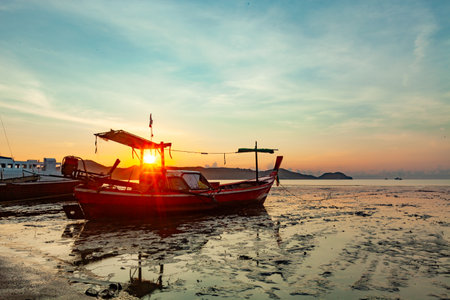 Longtail boats with Travel boats in tropical sea, Beautiful scenery morning sunrise or sunset sky over sea and mountain in phuket thailand, Amazing light of nature landscape Seascapeの写真素材