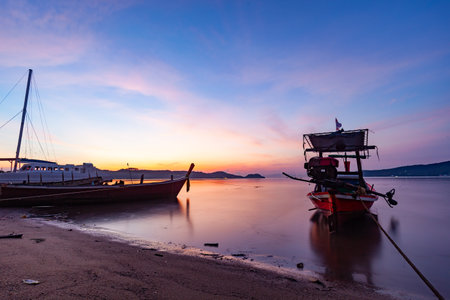 Longtail boats with Travel boats in tropical sea, Beautiful scenery morning sunrise or sunset sky over sea and mountain in phuket thailand, Amazing light of nature landscape Seascapeの写真素材