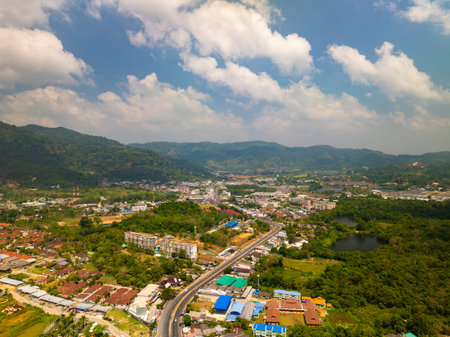 Aerial view of residential houses and driveways neighborhood during a fall sunset or sunrise time.Tightly packed homes.Top view over building houses in phuket thailandの写真素材