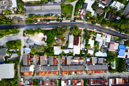 Aerial view of residential houses and driveways neighborhood during in sunny time.Tightly packed...