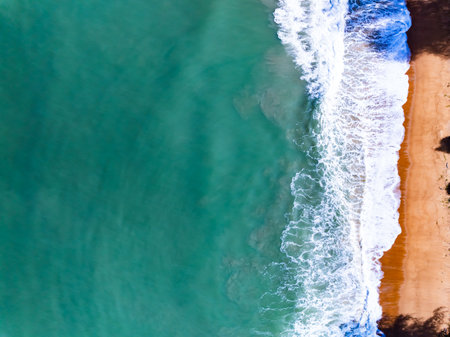 Top view waves crashing on sandy shore, Beach sea space nature backgroundの写真素材