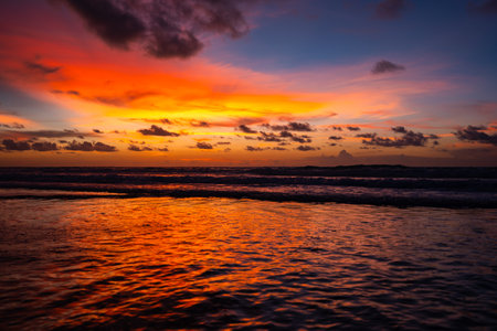 Sunset sky over sea background,Landscape nature of beautiful Light Sunset or sunrise over sea,Colorful clouds scenery sky,Amazing clouds and waves in sunset sky nature cloud backgroundの写真素材