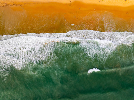 Top view sea surface waves crashing in summer season seascape background,Nature sea beach background,High angle view amazing waves,Wide angle image beach backgroundの写真素材