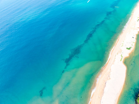 Amazing sea surface in summer season background,Nature waves sea beach background,High angle view waves seascape nature view,Wide angle drone shot,Top view beach sandの写真素材