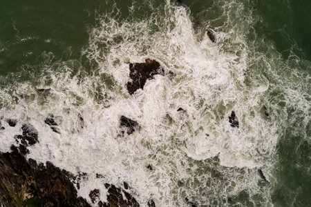 Top view waves crashing on rocks seascape background,Wide angle sea nature background