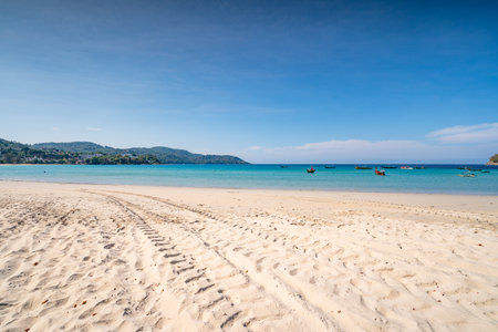 Empty tropical beach and seascape, Beautiful sandy beach and sea in sunny day,Blue sky in good weather day, Beach sea space area nature backgroundの写真素材