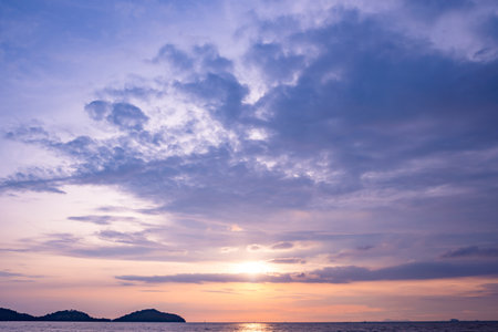 Nature beautiful light sunset or sunrise over sea surface,Colorful sunset sky with clouds and waves in the ocean,Wide angle sea backgroundの写真素材