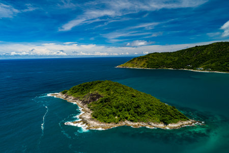 Aerial view Top down seashore, Waves crashing on rocks cliff, Beautiful sea surface in sunny day summer background, Amazing seascape top view seacoastの写真素材