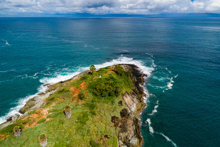 Aerial view Top down seashore, Waves crashing on rocks cliff, Beautiful sea surface in sunny day summer background, Amazing seascape top view seacoastの写真素材