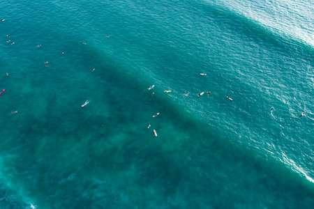 Aerial view Waves crashing on sandy shore,Sea surface in summer day background,Seascape top view waves texture background.の写真素材