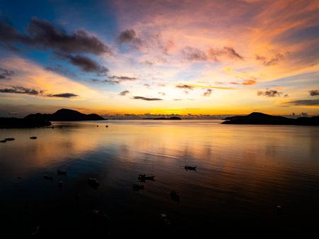 Aerial view sunset sky,Nature beautiful light Sunset or sunrise over sea,Colorful scenery sunset sky background,Amazing clouds and waves in sunrise sky nature light cloud backgroundの写真素材