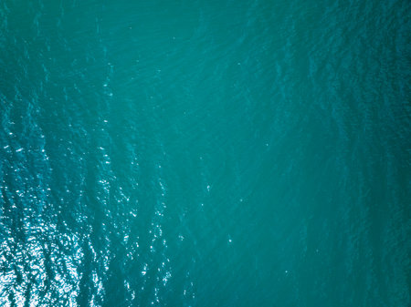 Top view sea surface nature background,Wide angle view ocean waves texture backgroundの写真素材