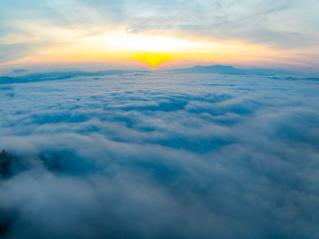 Amazing Sunrise over mountains hills covered with mist, Aerial view landscape drone shot beautiful...