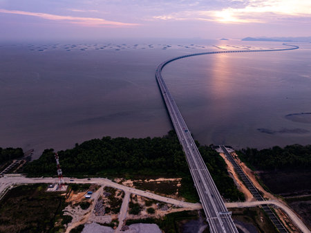 Amazing aerial view of the Penang Bridge in sunset or sunrise sky backgroundの写真素材