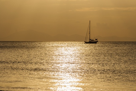 Sailing boat on a beautiful sunset の写真素材