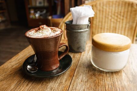 A cup of hot chocolate with whipped cream の写真素材