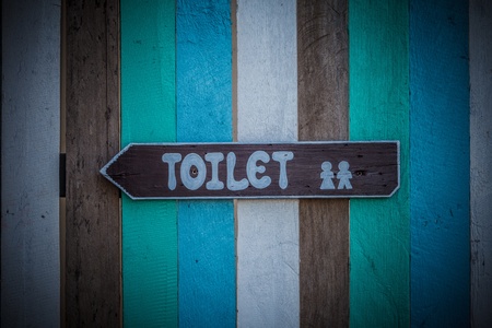 Toilet signs on the old wood wallの写真素材