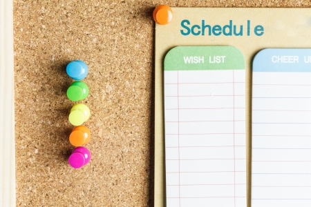 cork board with schedule listの写真素材