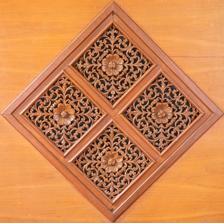 Pattern of flower carved on wood backgroundの写真素材