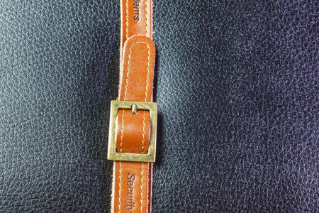 A brown belt and black leather textureの写真素材