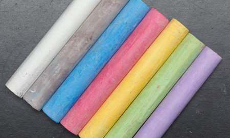 Sticks of chalk on a blackboard