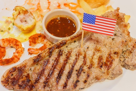 Steak with grilled shrimpsの写真素材