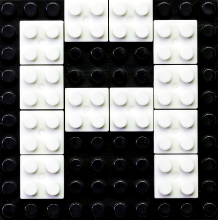 Alphabet made of toy construction brick blocks の写真素材