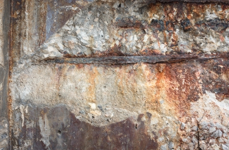 Destruction of a concrete wall with rustyの写真素材