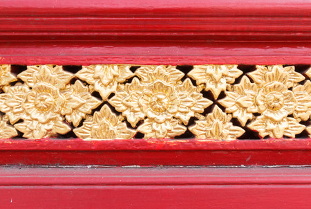 Golden wooden statue of the Thai style wallの写真素材