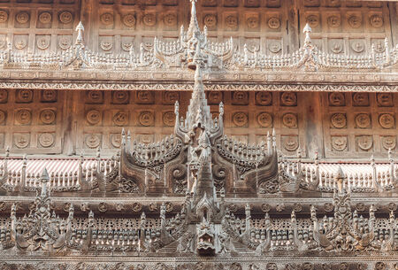 detail of carved wooden statue at Shwenandaw Kyaung Templeの写真素材