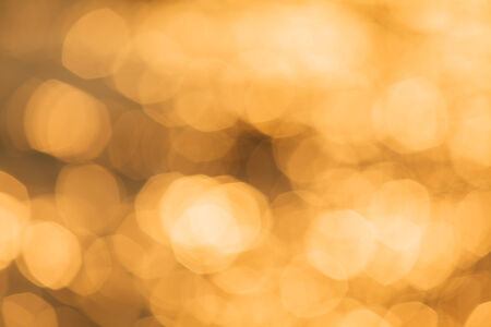 abstract background with bokeh defocused lightsの写真素材