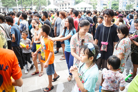BANGKOK, THAILAND - APRIL 12  Locals and tourists enjoy in  Bangkok Songkran Festival 2014 Thailand new year   at Central World on April 12,2014 in Bangkok, Thailandのeditorial素材