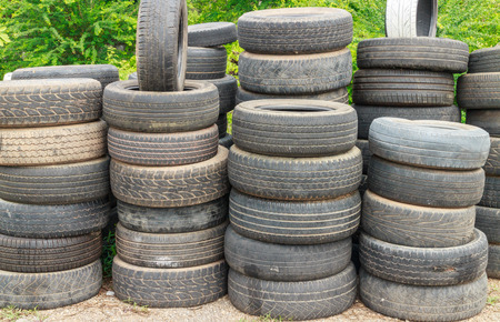 Pile of old car tires for rubber recyclingの写真素材