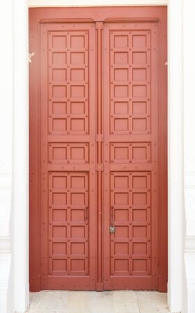 brown vintage ornate decorative timber door in Grand Palace, Thailandの写真素材