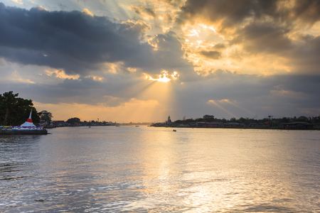 Beautiful sunset beams over the riverの写真素材