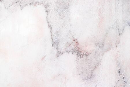The surface of the marble, white, pink, with black patterns, inserted, looks beautiful, polished, already polished, prepared for furniture.の写真素材