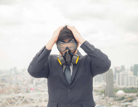 Portrait of real estate businessman. Front view businessman standing cross one's arm for planing in the concept of real estate and engineering at top of buildingの写真素材