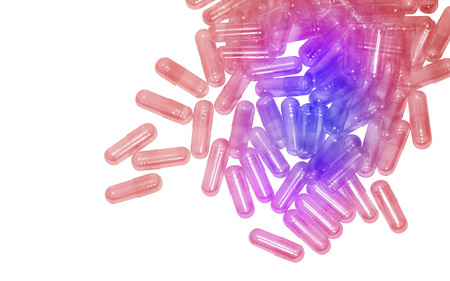 Many red and blue pills isolated on whiteの写真素材