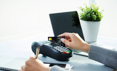 asian young business woman hands holding credit card and using laptop smart phone Online...