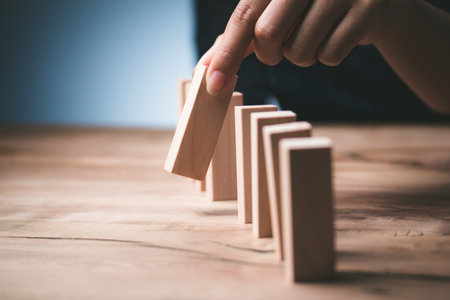 Man hand pick one wood block from many wood block to business concept in choose idea person from many candidate and different  Select resources Of the best and most outstanding companiesの写真素材