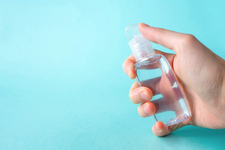 hand hold bottle alcohol clean with hand sanitiser liquid bottle . concenpt protection sanitiser...