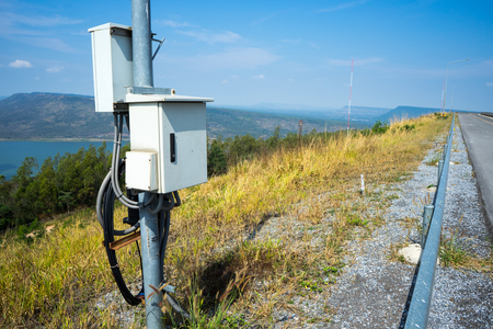 The electricity post in the damの写真素材