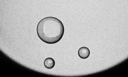 water droplets on a gray waterproof surface studio shotの写真素材