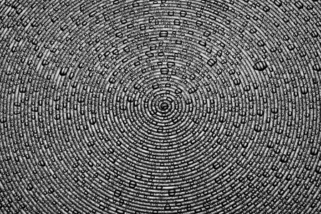 water droplets on a  surface of concentric circles studio shotの写真素材