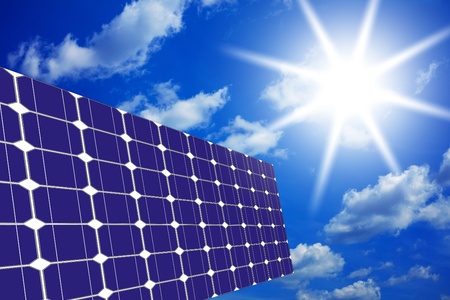Image of solar panels - clean energy source on the background of sky and bright sunの写真素材