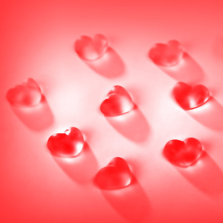 candies in the form of heart red background